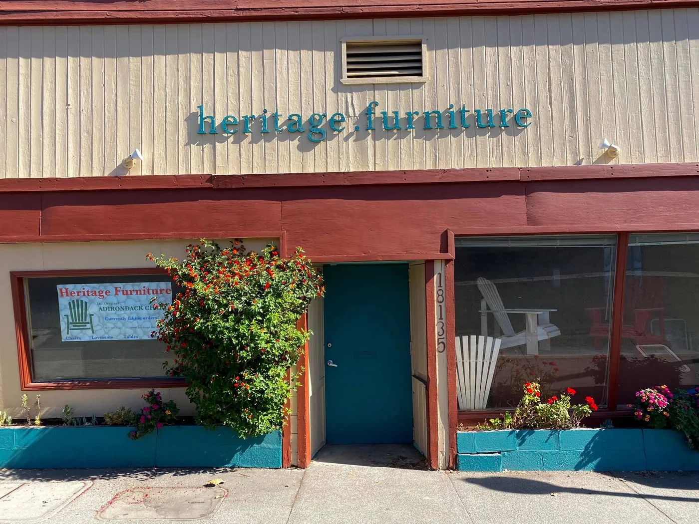 Heritage Furniture storefront with Adirondack chairs displayed in the windows
